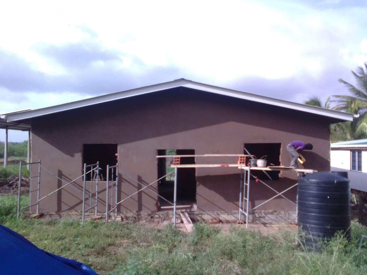 4J's Enterprises construction team at work on a project in Trinidad